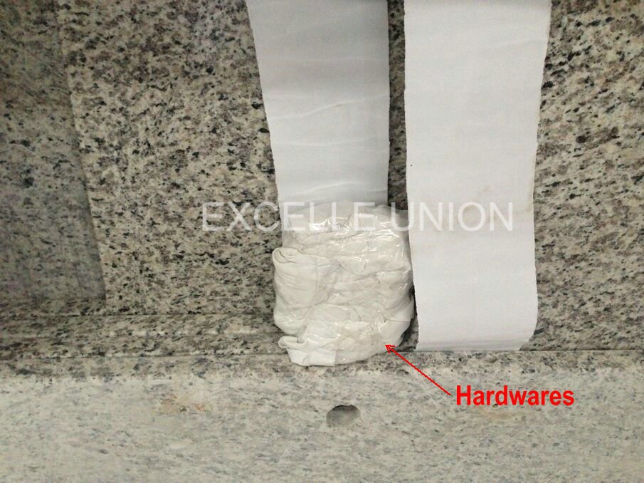 Granite countertop installation hardware and pre-drilled detail